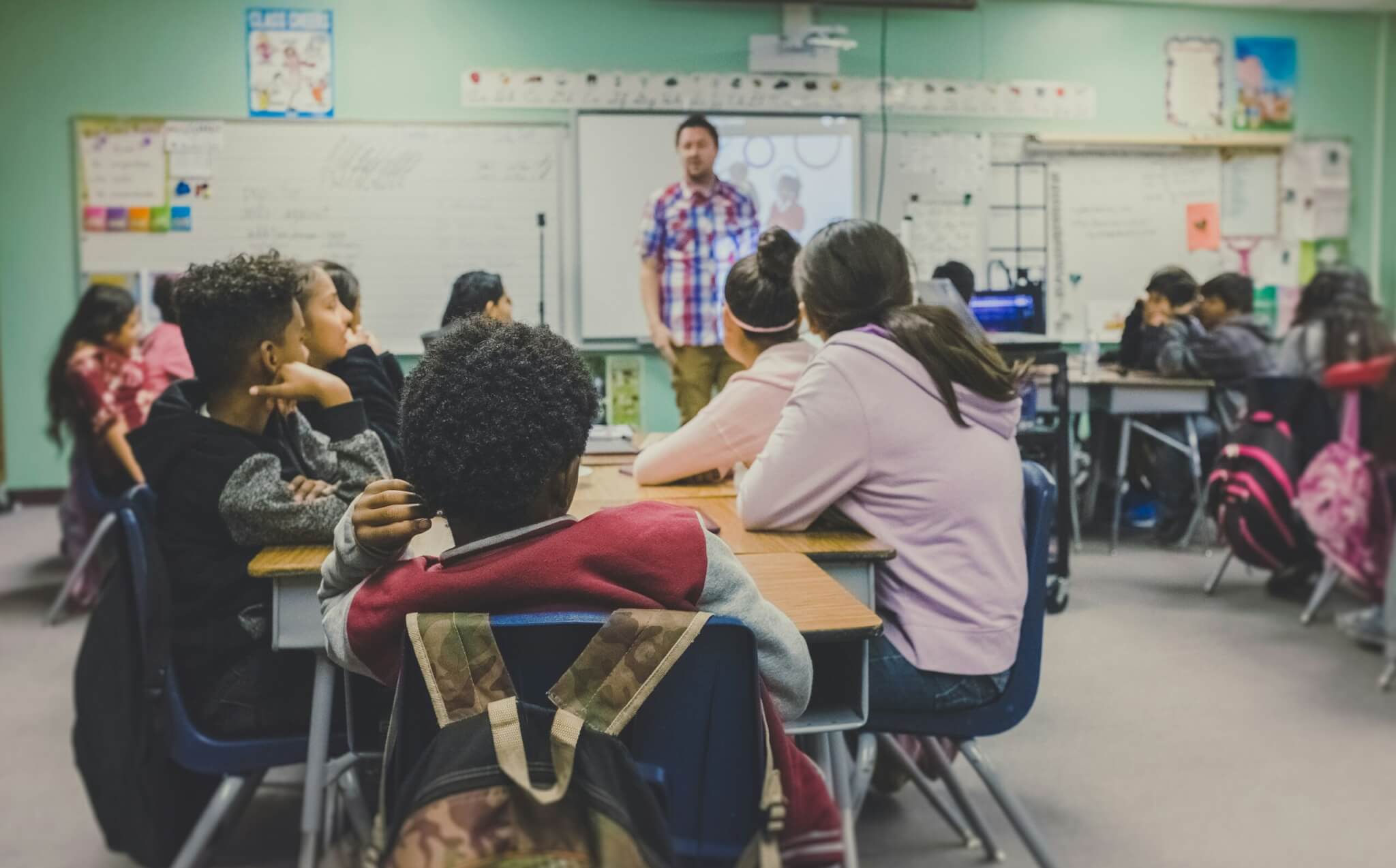 Supply teacher taking a class in a school