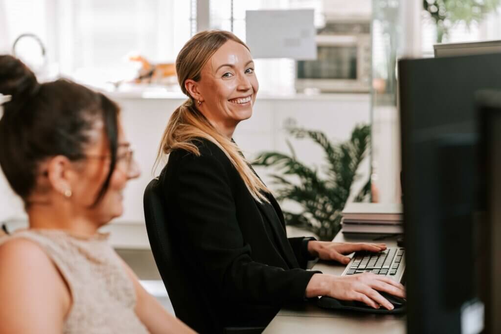 An education recruitment specialist at their desk. 